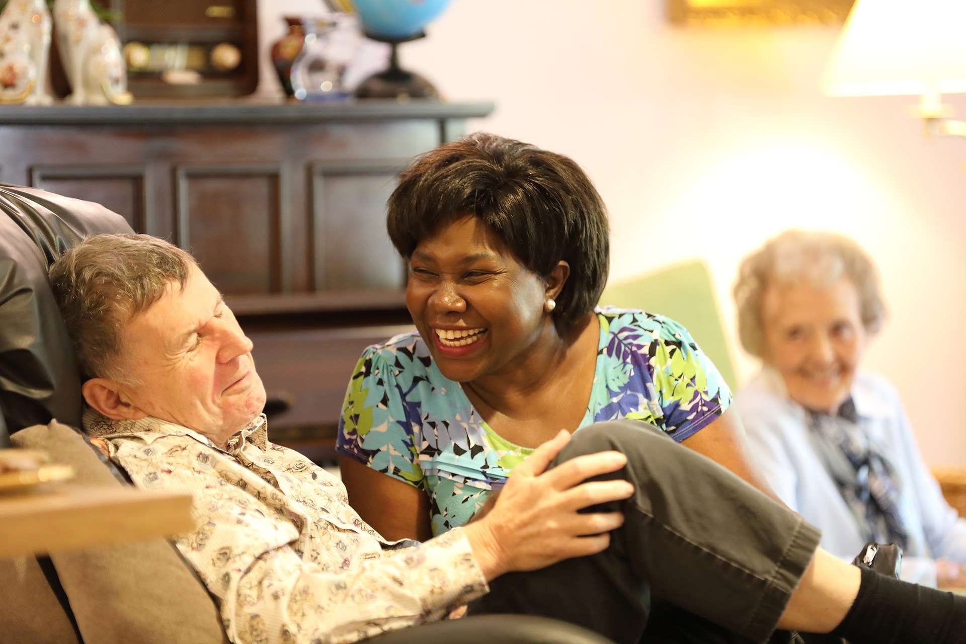 CCH Image displaying a carer enjoying conversation with a resident