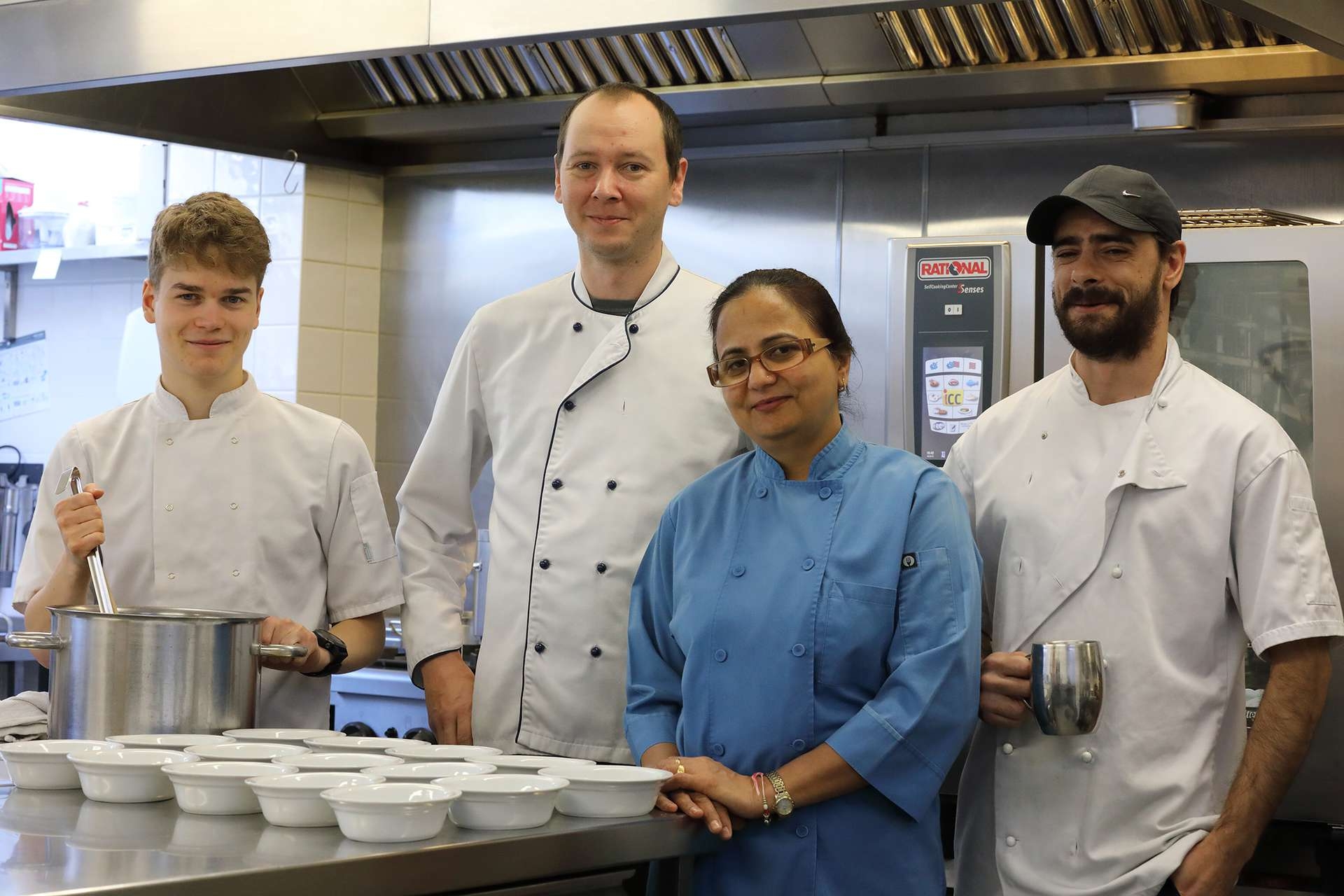 CCH Image showing all of the cooking staff alongside the head chef
