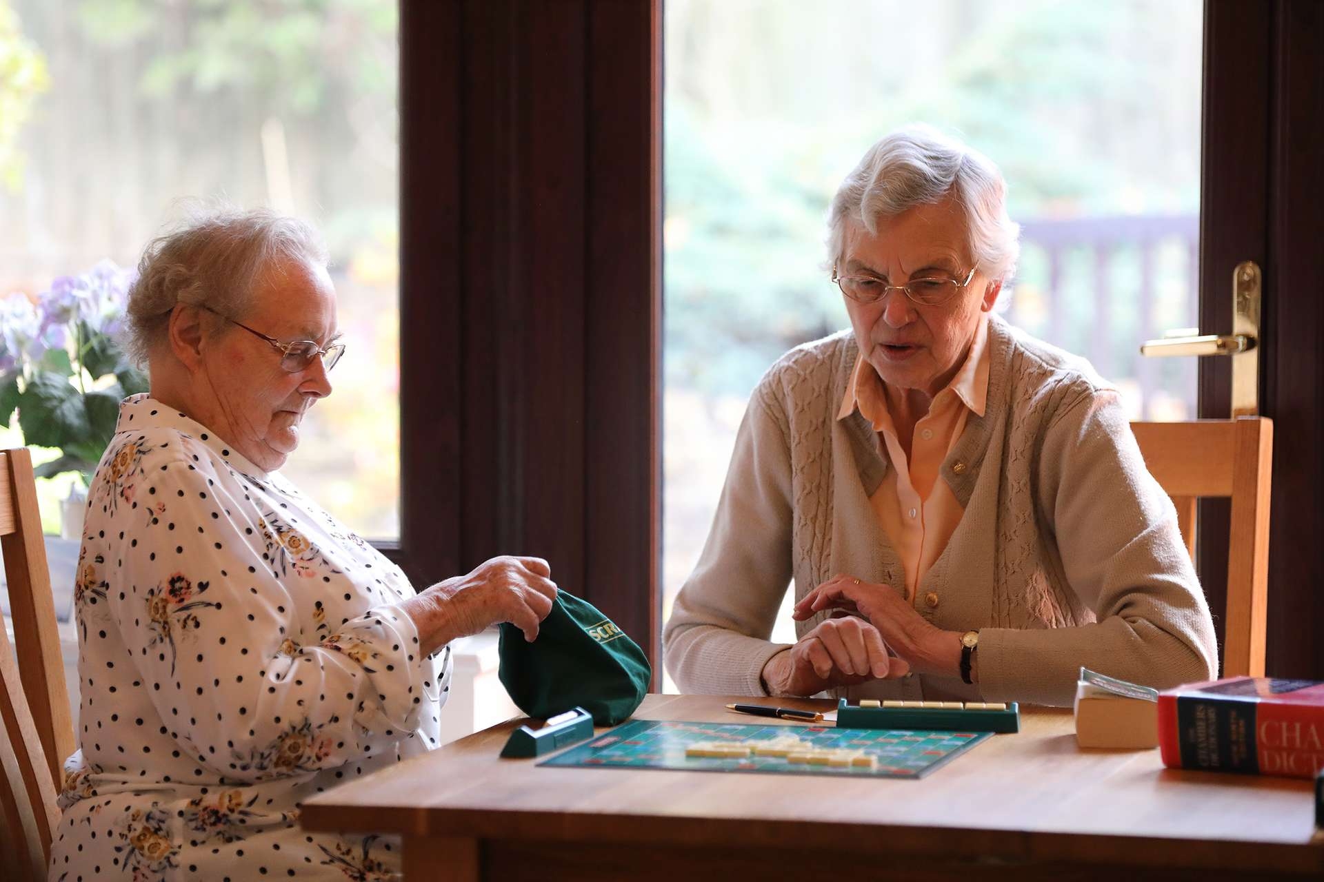 CCH Kingsleigh Gallery Image displaying two residents sat at the table playing board games