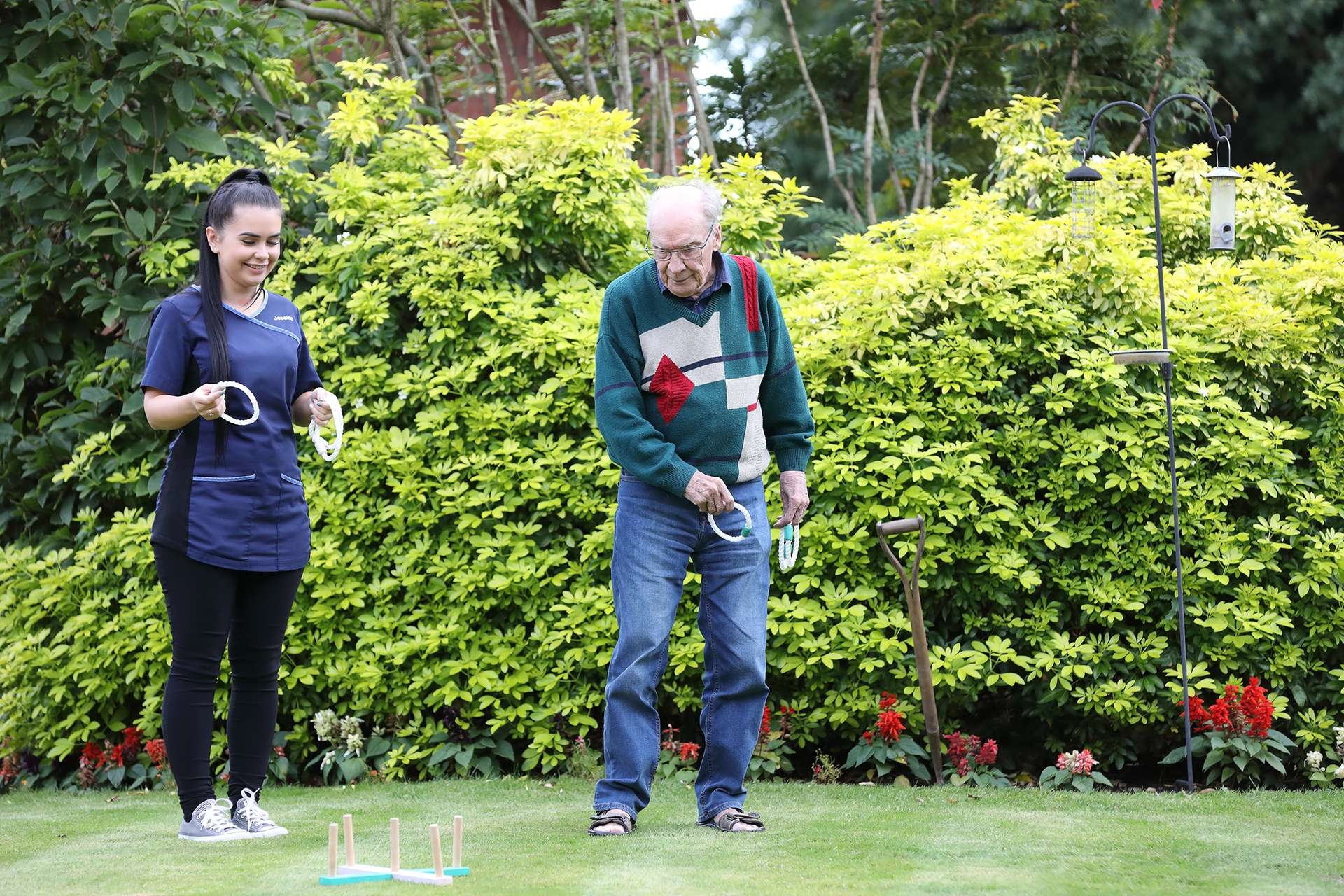 CCH Kingsleigh Gallery Image showing a resident playing outdoor games with theaid of a carer